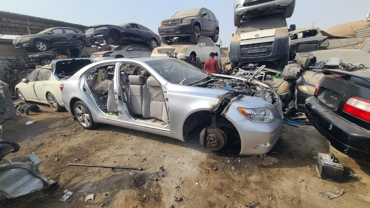 Silver Lexus scrap car in Dubai yard